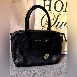 Furla black leather jet handbag/crossbody. In excellent condition. Gold charm